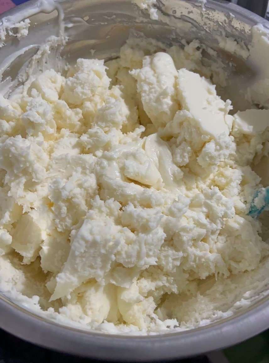 Image of our unscented whipped body butter in its natural state being prepared in a silver metal bowl- Real Blew Cosmetics