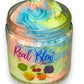 A colorful jar of Froot Loop scented whipped body butter with swirls of blue, green, yellow, and pink to mimic the iconic cereal. The label reads “Real Blew Body Butter” with images of fruit loops below.