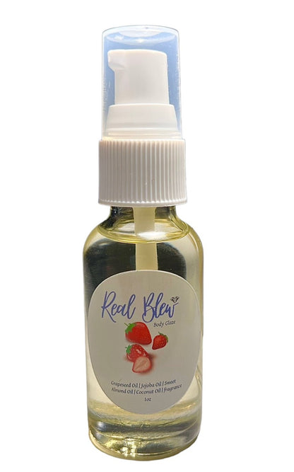 1oz clear glass bottle with a white pump cap, and clear cover top, filled with natural gold oils, and scented with strawberry shortcake fragrance oil- Real Blew Cosmetics