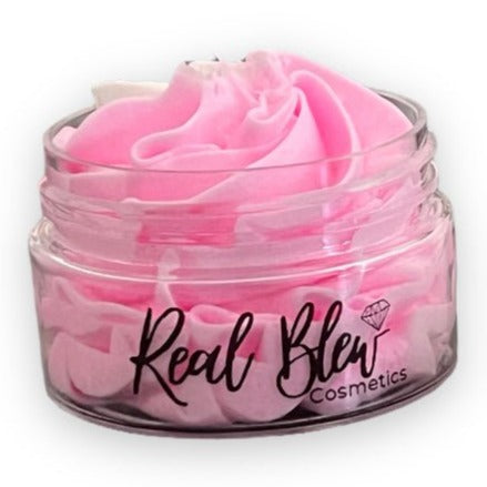 A cute 1oz clear travel size jar with fluffy light pink body butter scented with strawberry shortcake fragrance oil - Real Blew Cosmetics